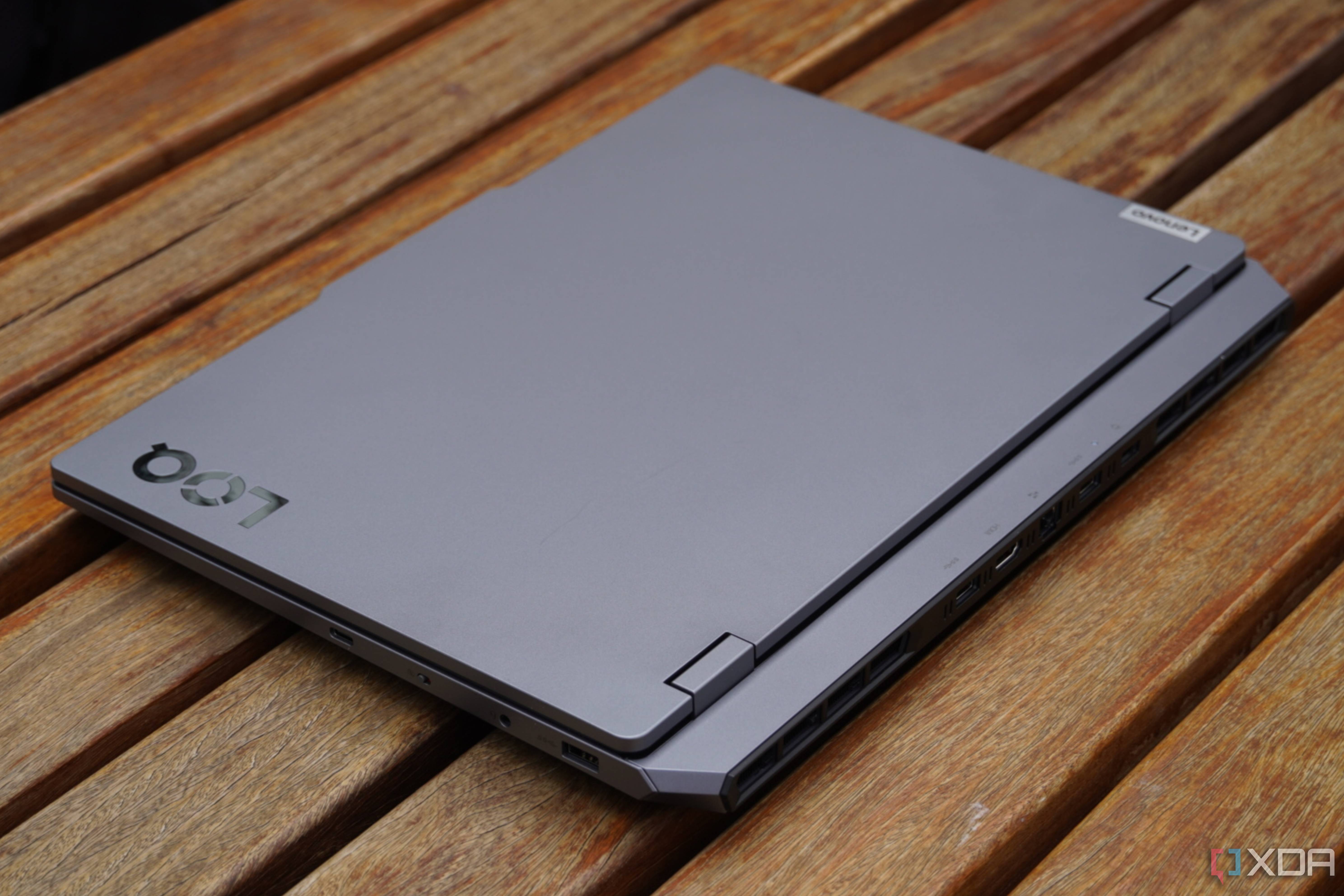 The Lenovo LOQ 15 closed on a picnic table.