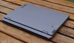 A closed Lenovo LOQ 15 on a picnic table.