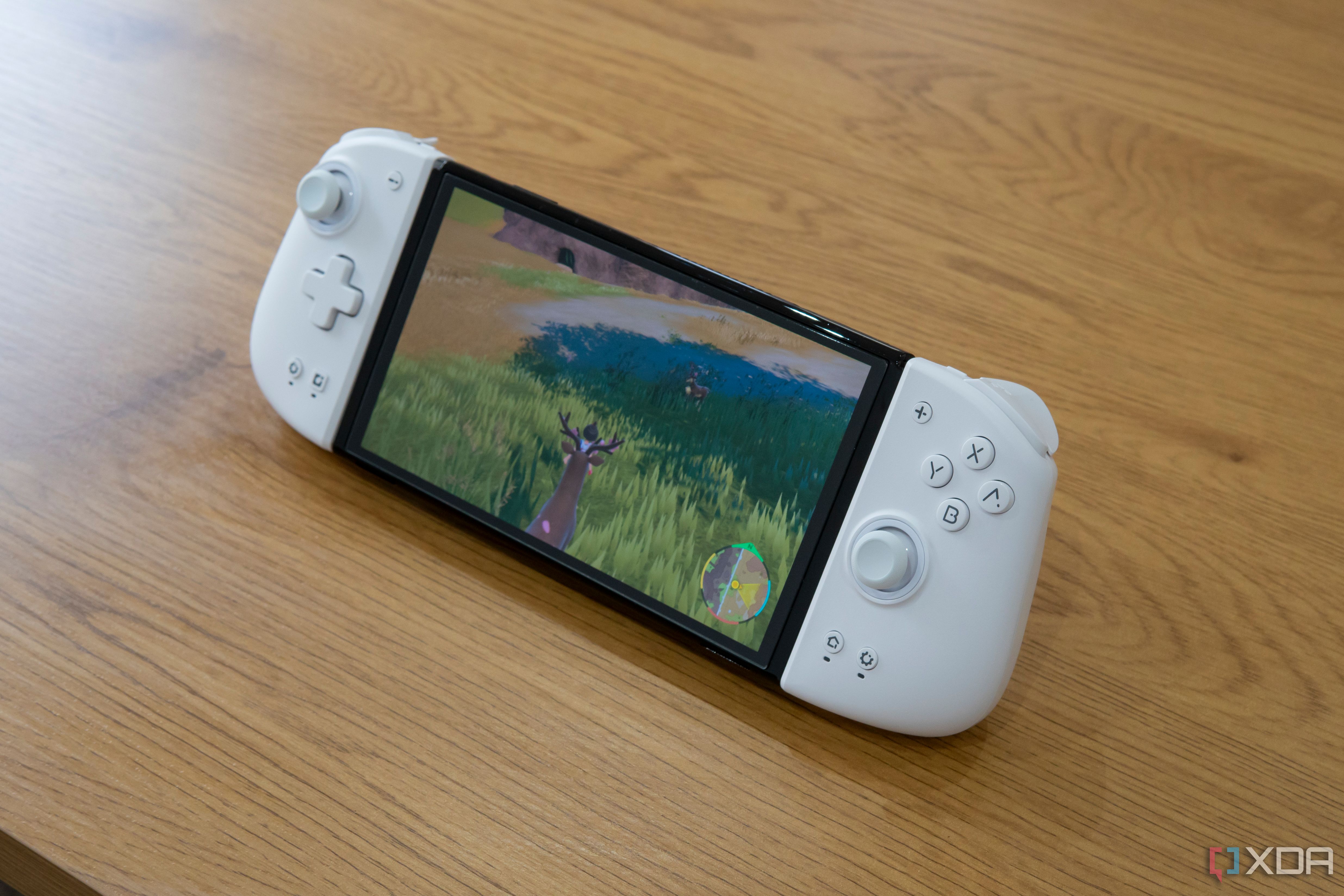 A Nintendo Switch OLED in tabletop mode with the Mobapad M6 HD attached