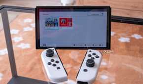A Nintendo Switch with the Joy-Con detached showing groups of apps