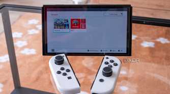 A Nintendo Switch with the Joy-Con detached showing groups of apps