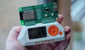 Flipper Zero in-hand with Wi-Fi dev board on top