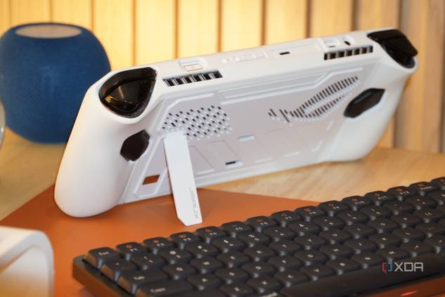 Using an ROG Ally case with a stand to prop up the handheld.