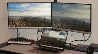A MacBook Air connected to two external monitors.