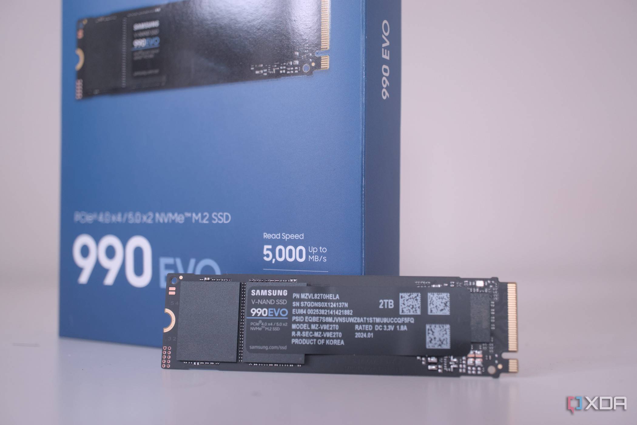An image of the Samsung 990 Evo hero SSD with its packaging box in the background.