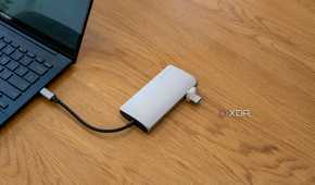 A Satechi Multiport Adapter 8K with Ethernet V3 connected to a laptop with a USB drive plugged in