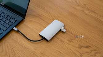 A Satechi Multiport Adapter 8K with Ethernet V3 connected to a laptop with a USB drive plugged in
