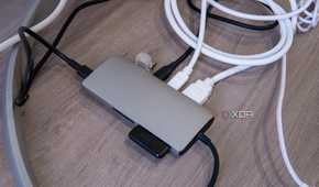 Satechi Multiport Adapter 8K with Ethernet V3 with a display and multiple peripherals connected