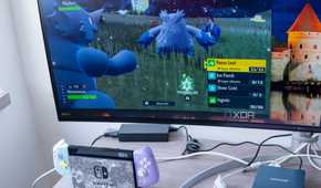 A NIntendo Switch next to a computer monitor displaying a video feed from the Switch