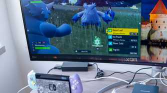 A NIntendo Switch next to a computer monitor displaying a video feed from the Switch