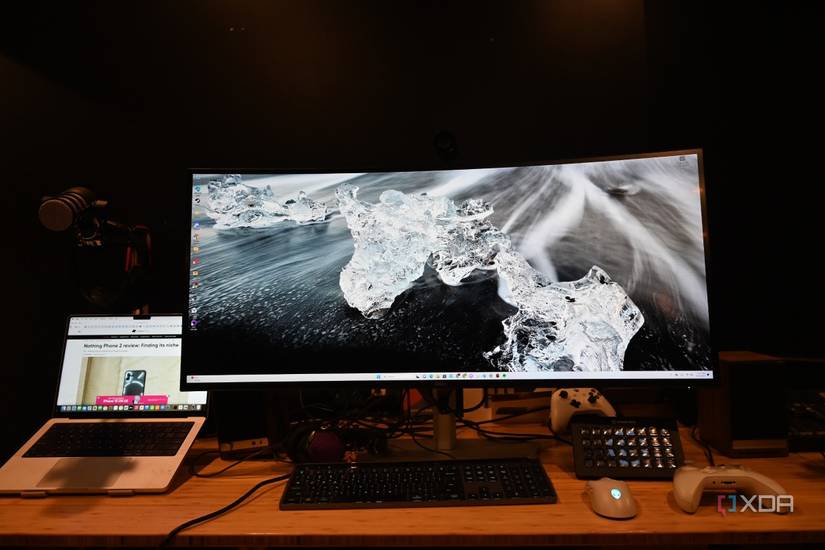 Dell UltraSharp 40 Curved Thunderbolt Hub Monitor with wallpaper of clear ice on a black surface