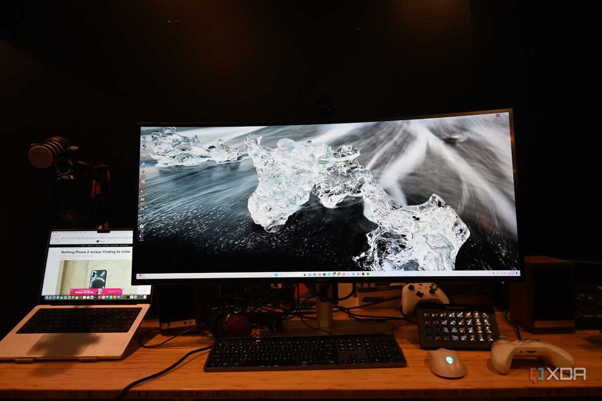 Dell UltraSharp 40 Curved Thunderbolt Hub Monitor with wallpaper of clear ice on a black surface