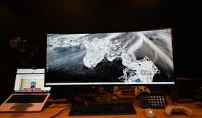 Dell UltraSharp 40 Curved Thunderbolt Hub Monitor with wallpaper of clear ice on a black surface