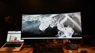 Dell UltraSharp 40 Curved Thunderbolt Hub Monitor with wallpaper of clear ice on a black surface
