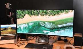 Dell UltraSharp 40 Curved Thunderbolt Hub Monitor with MacBook Pro, eyeglasses, Legato Stream Deck, white wireless mouse and white Xbox controller