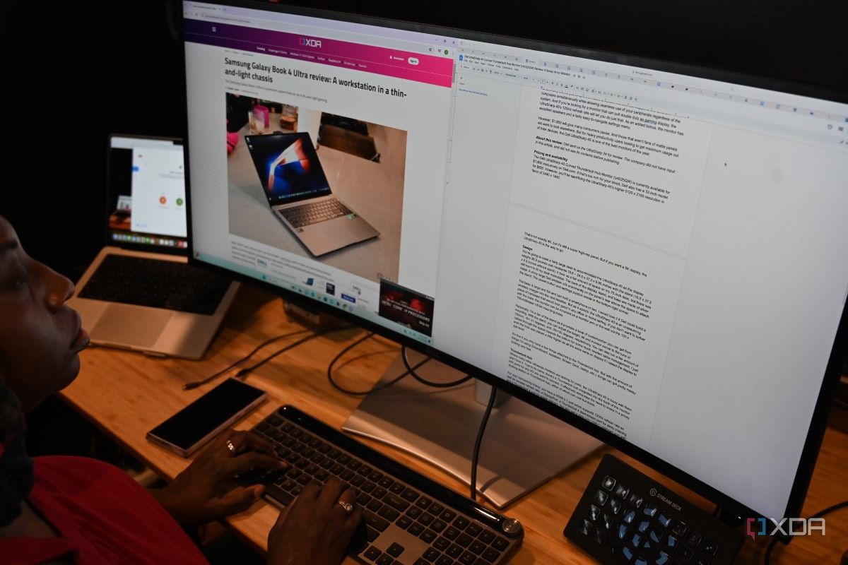 African-American woman using Dell UltraSharp 40 Curved Thunderbolt Hub Monitor