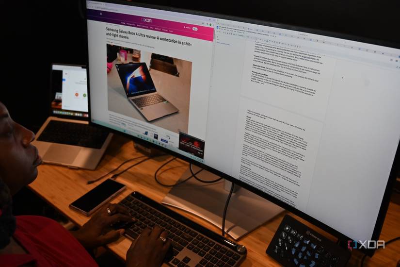 African-American woman using Dell UltraSharp 40 Curved Thunderbolt Hub Monitor