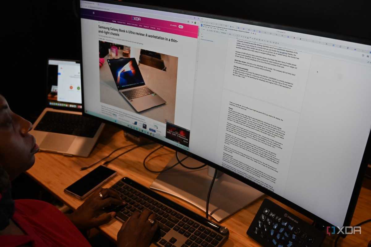 African-American woman using Dell UltraSharp 40 Curved Thunderbolt Hub Monitor