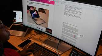 African-American woman using Dell UltraSharp 40 Curved Thunderbolt Hub Monitor