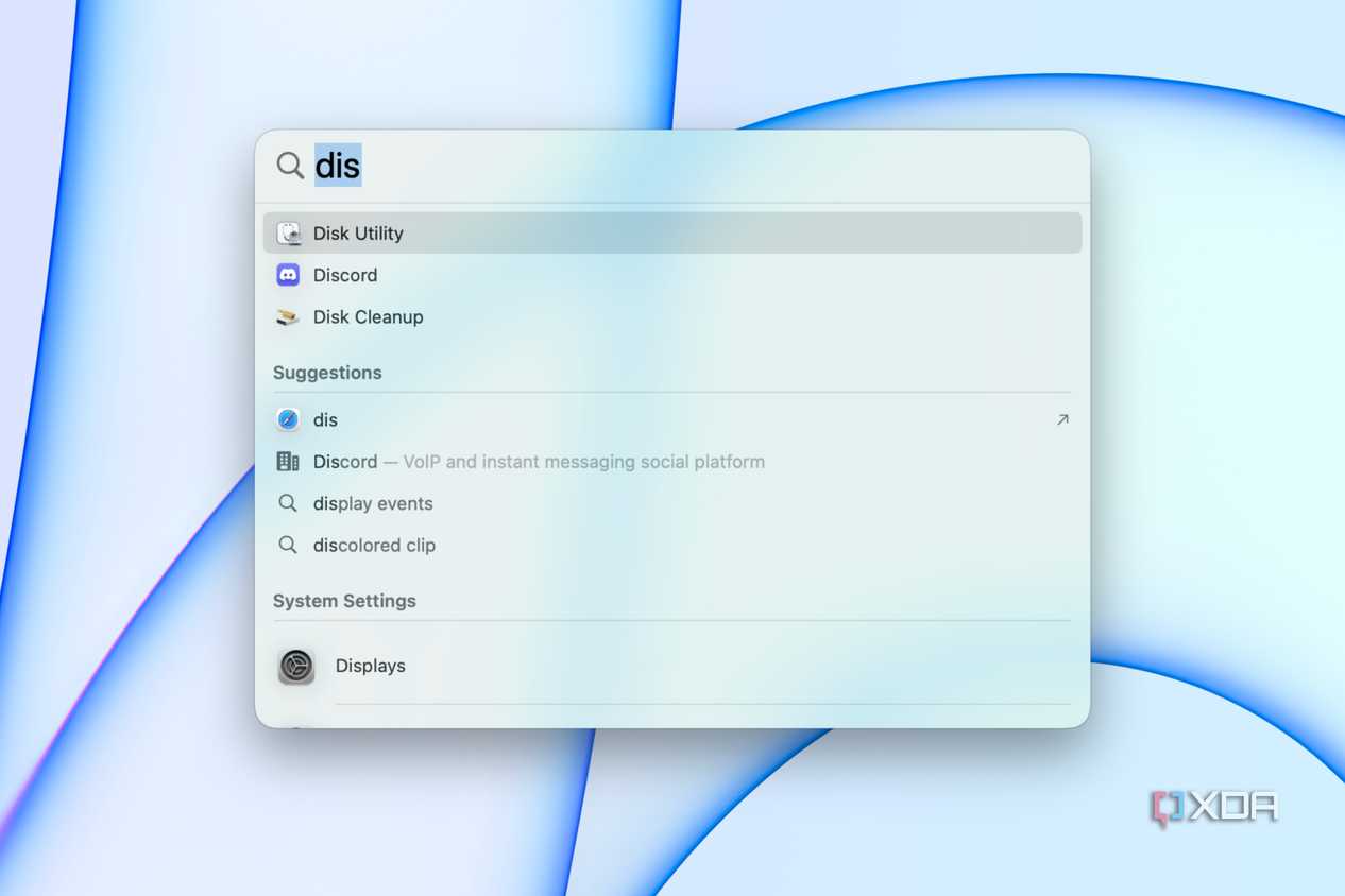 Searching for Disk Utility in Spotlight.