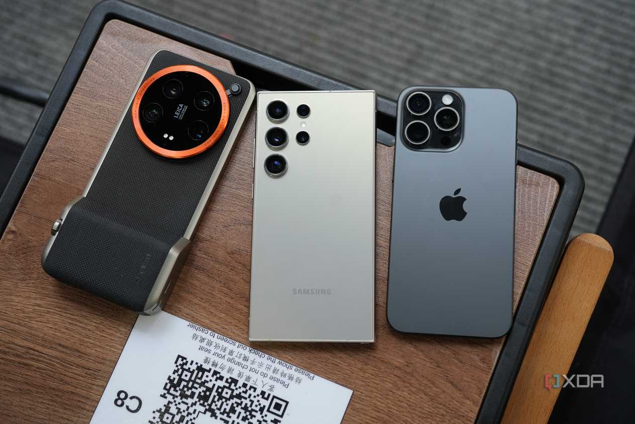 xiaomi 14 ultra, s24 ultra and iphone 15 pro max side by side on a table