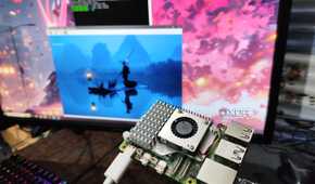 A headless Raspberry Pi, with PuTTY and RealVNC Viewer running on a monitor in the background