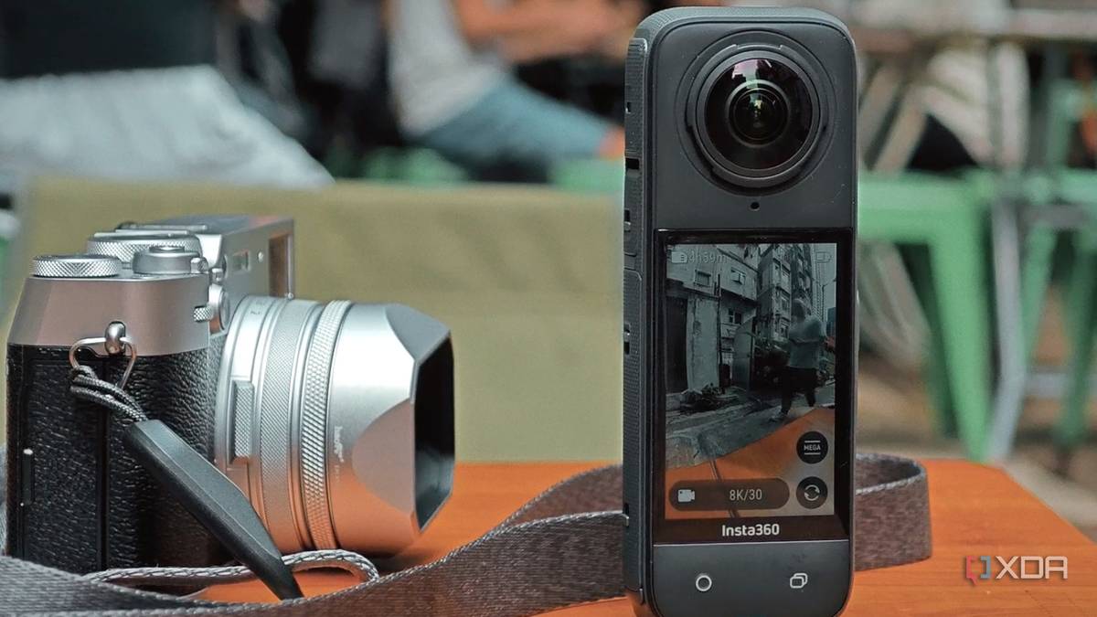 Insta360 X4 on a table with a Fujifilm X100 VI