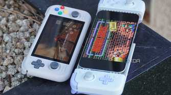 An iPhone next to an Android gaming handheld.