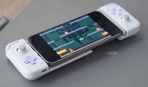 An iPhone connected to a mobile gaming controller.