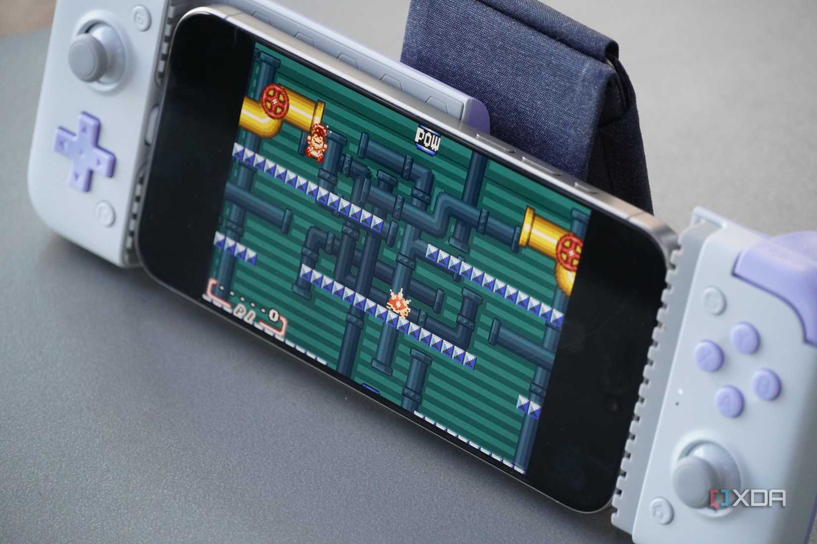 An iPhone running Mario on Delta Emulator.