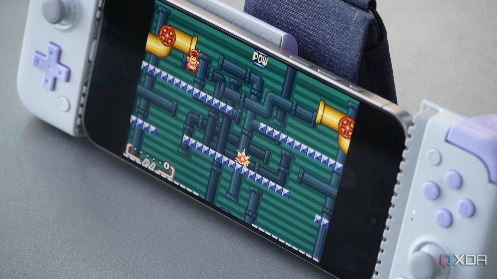 An iPhone running Mario on Delta Emulator.