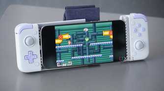 An iPhone connected to a bulky external game controller.