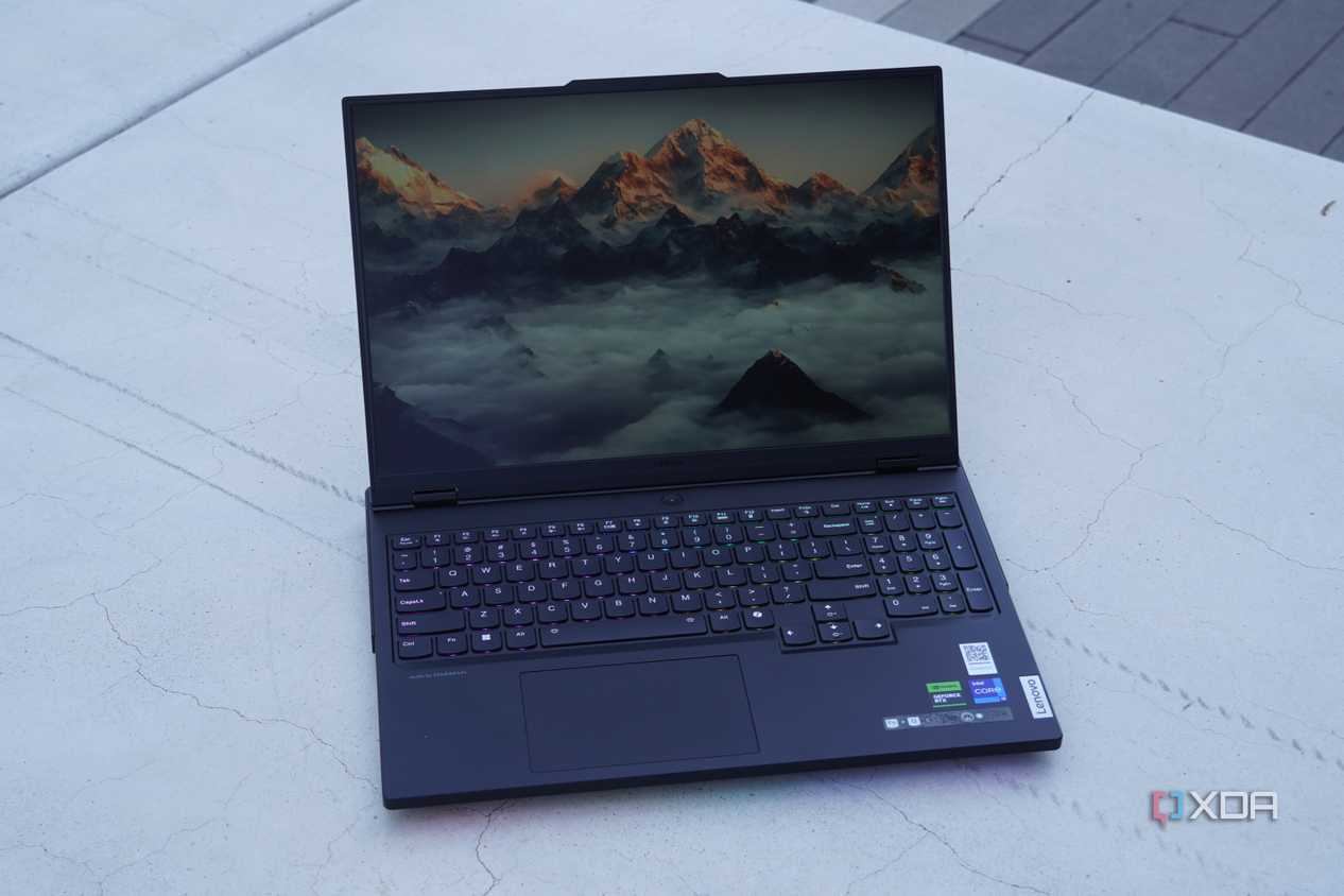 The Lenovo Legion Pro 7i on a concrete bench.