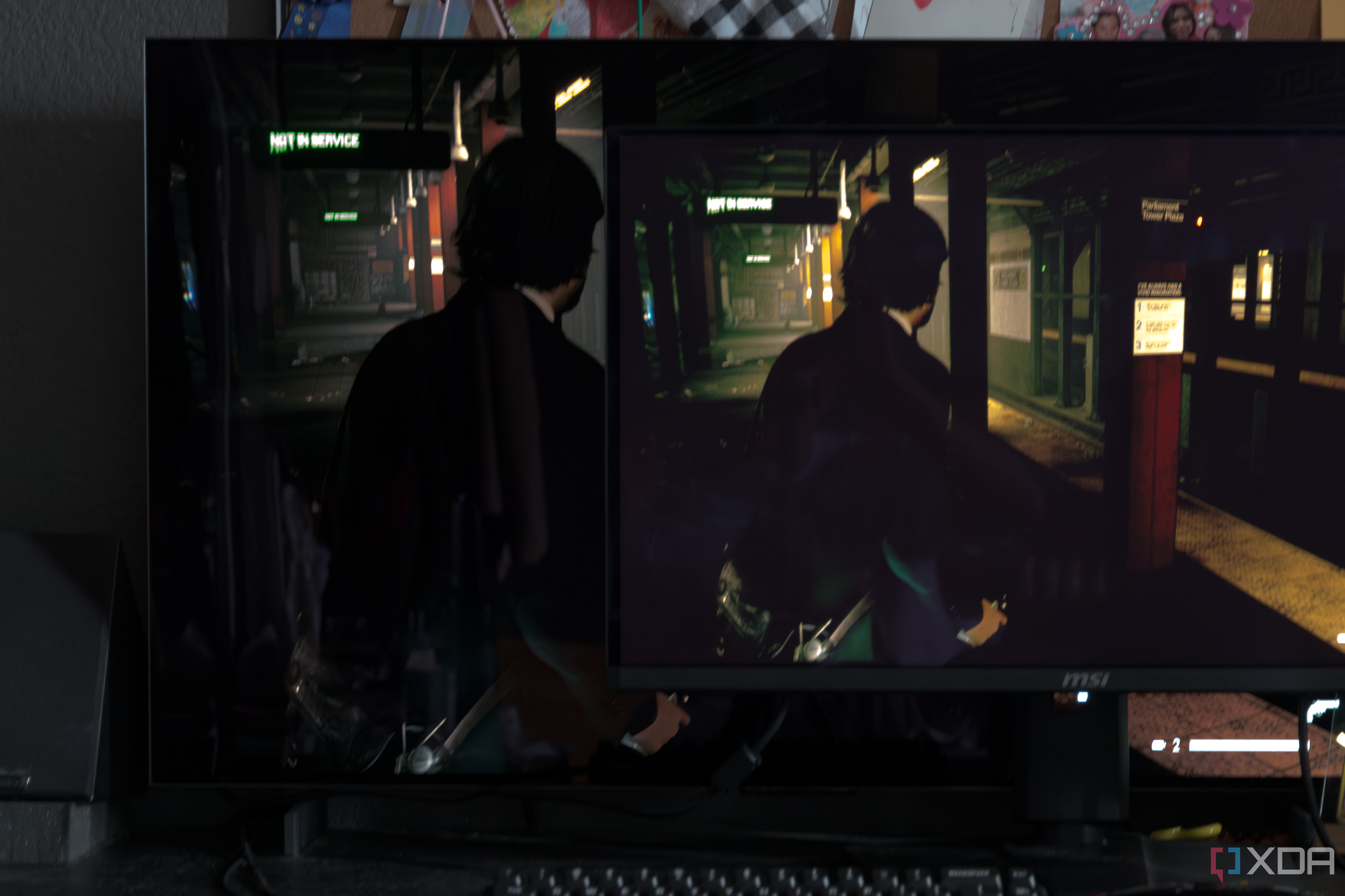 The MSI MAG 271QPX next to the LG C2 showing the difference in black levels in a game