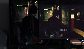 The MSI MAG 271QPX next to the LG C2 showing the difference in black levels in a game