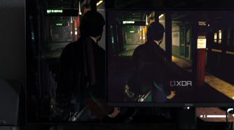 The MSI MAG 271QPX next to the LG C2 showing the difference in black levels in a game