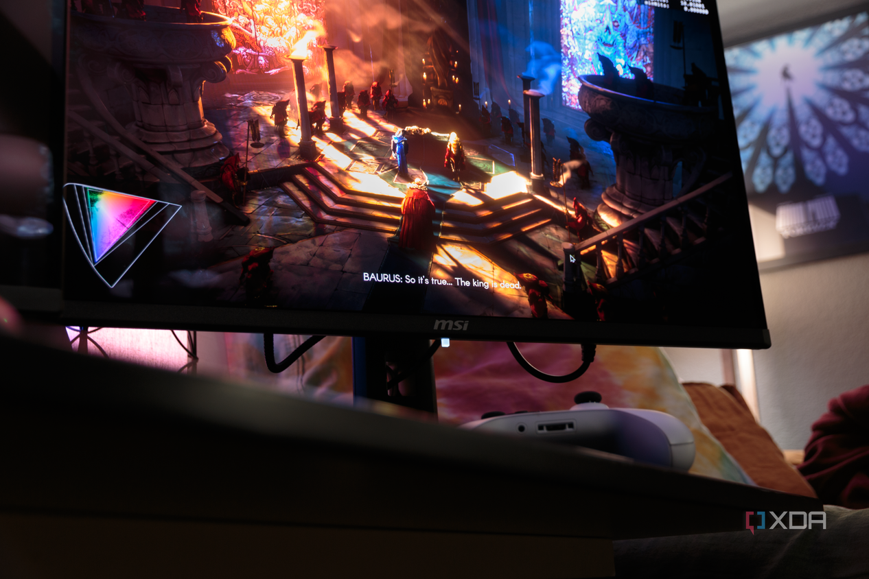 A cutscene being shown on the MSI MAG 271QPX with a controller present