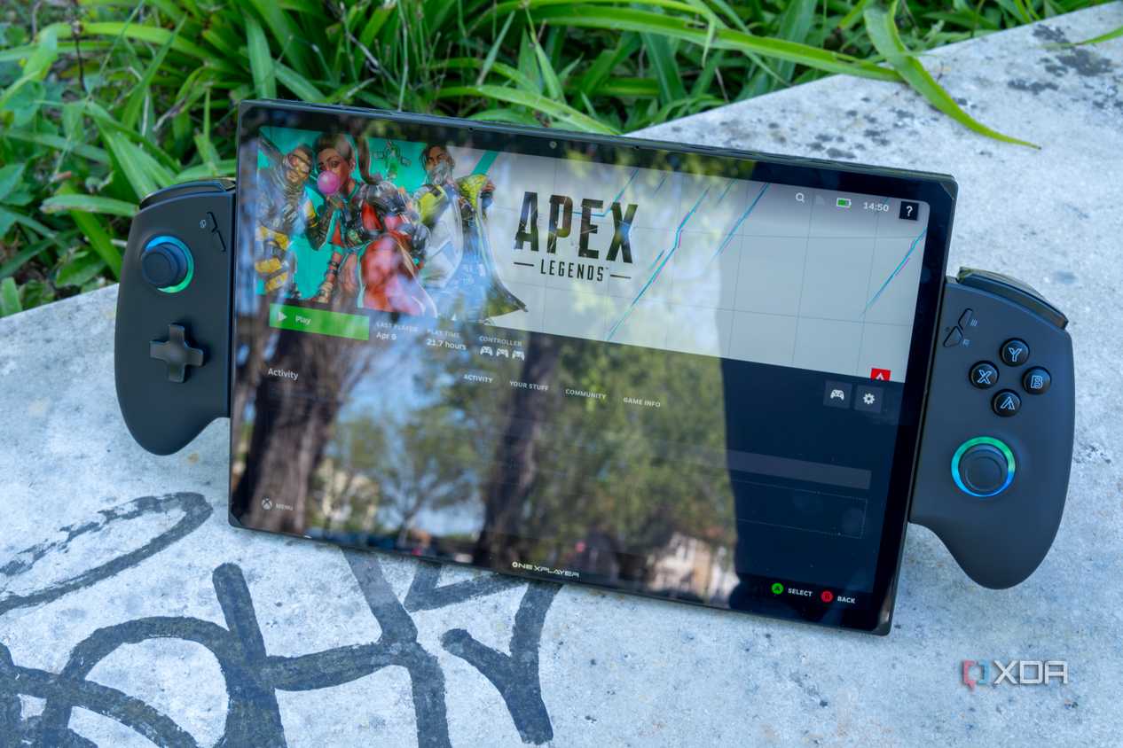 A One XPlayer X1 with controllers attached standing up on a stone slab