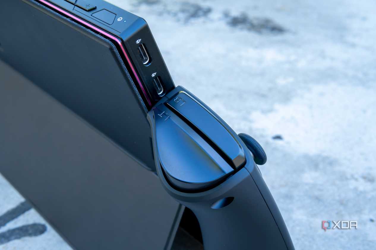 Close-up of the two USB Type-C ports on the One XPlayer with the controllers attached