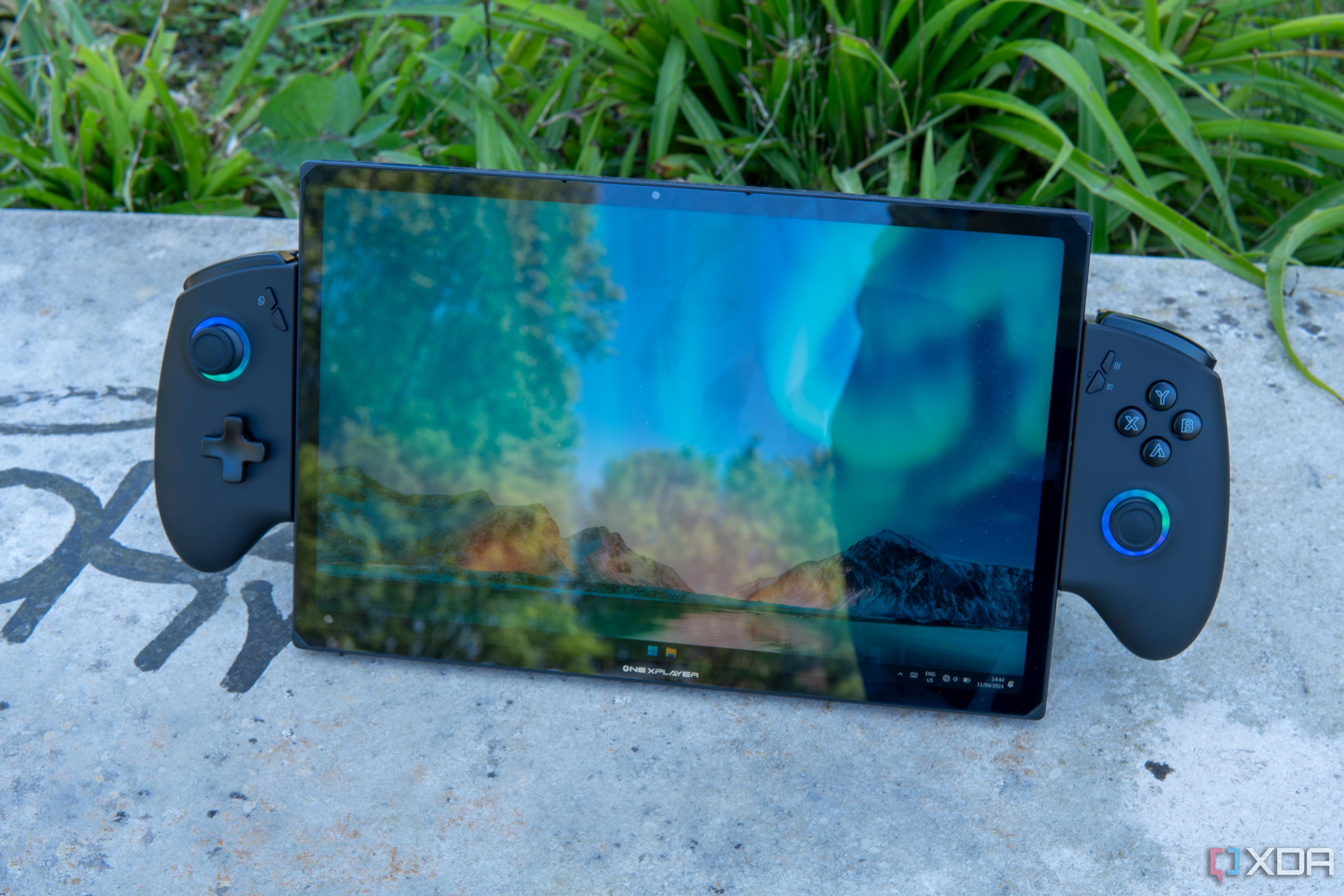 Angled front view of the One XPlayer X1 showing the Windows 11 desktop