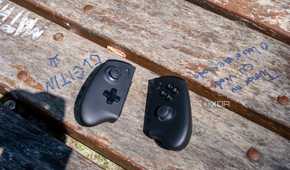 One XPlayer X1 controllers detached and set down on a wooden table
