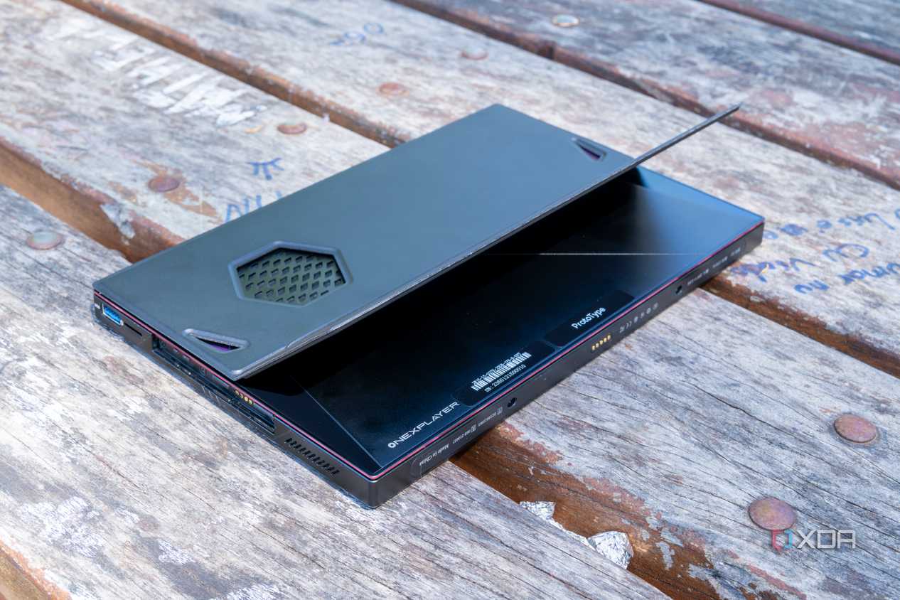 A One Xplayer X1 face down on a wooden table with the kickstand open