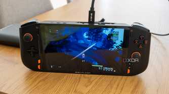 A One XPlayer Mini Pro running Risk of Rain 2 while connected to an external GPU