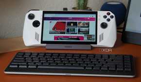 An image of an ASUS ROG Ally in front of a keyboard.