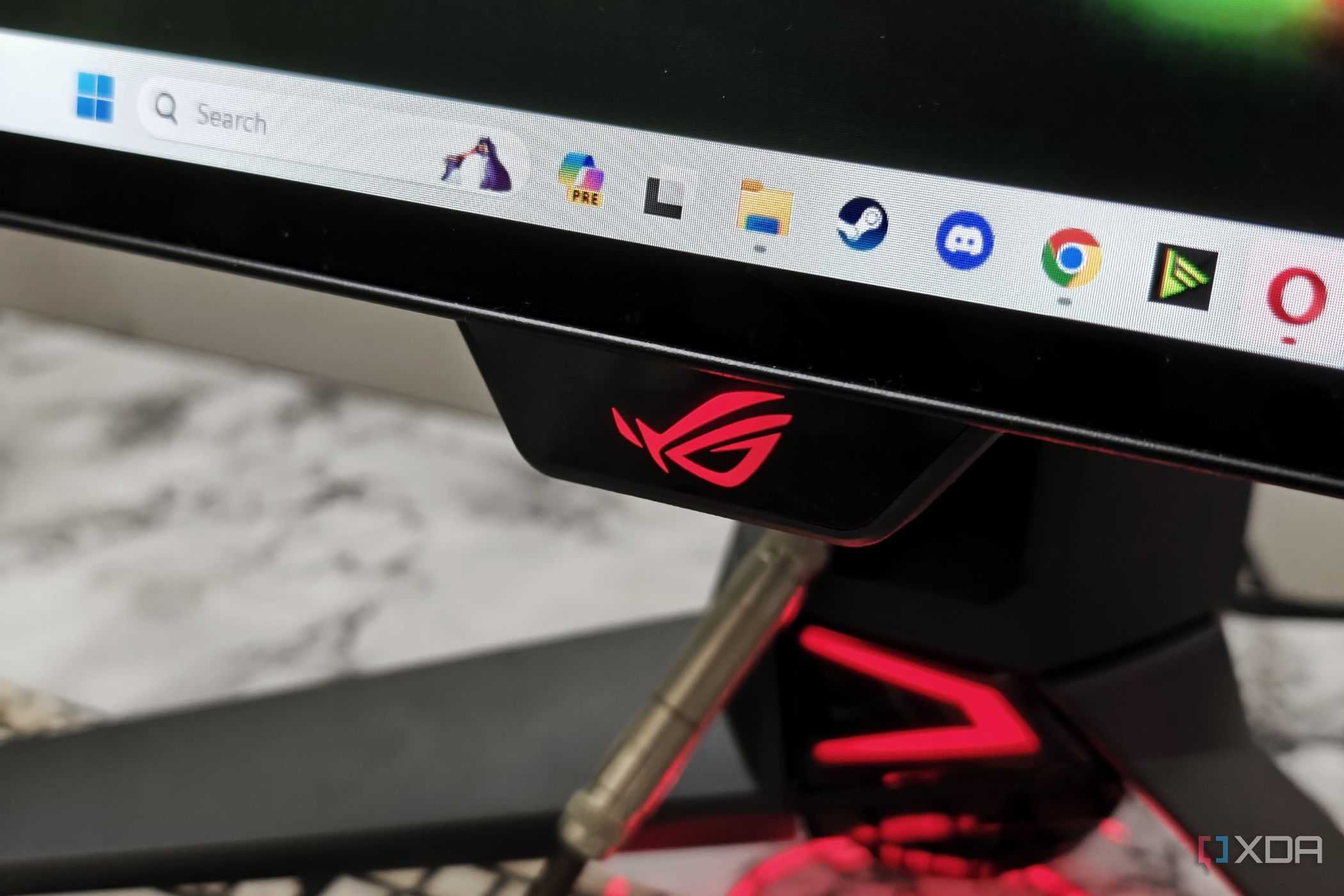 An image showing the Asus logo on the ROG PG27AQDM monitor.