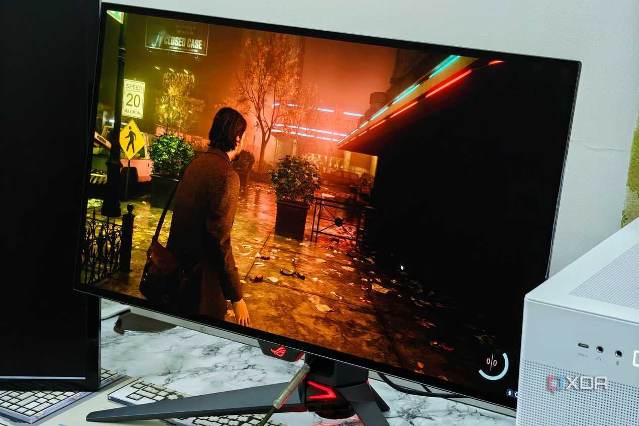 An image showing the Asus ROG PG27AQDM monitor displaying a screenshot from Alan Wake 2 game.
