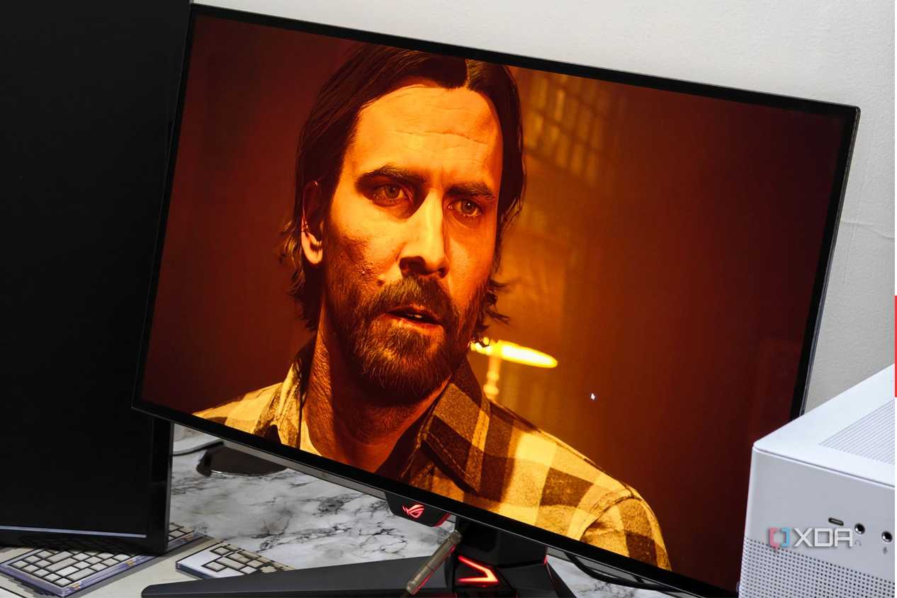 An image showing the Asus ROG Swift PG27AQDM monitor displaying a screenshot from Alan Wake 2 game.
