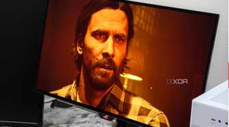 An image showing the Asus ROG Swift PG27AQDM monitor displaying a screenshot from Alan Wake 2 game.