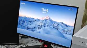 An image showing the Asus ROG PG27AQDM monitor displaying the Windows loackscreen.