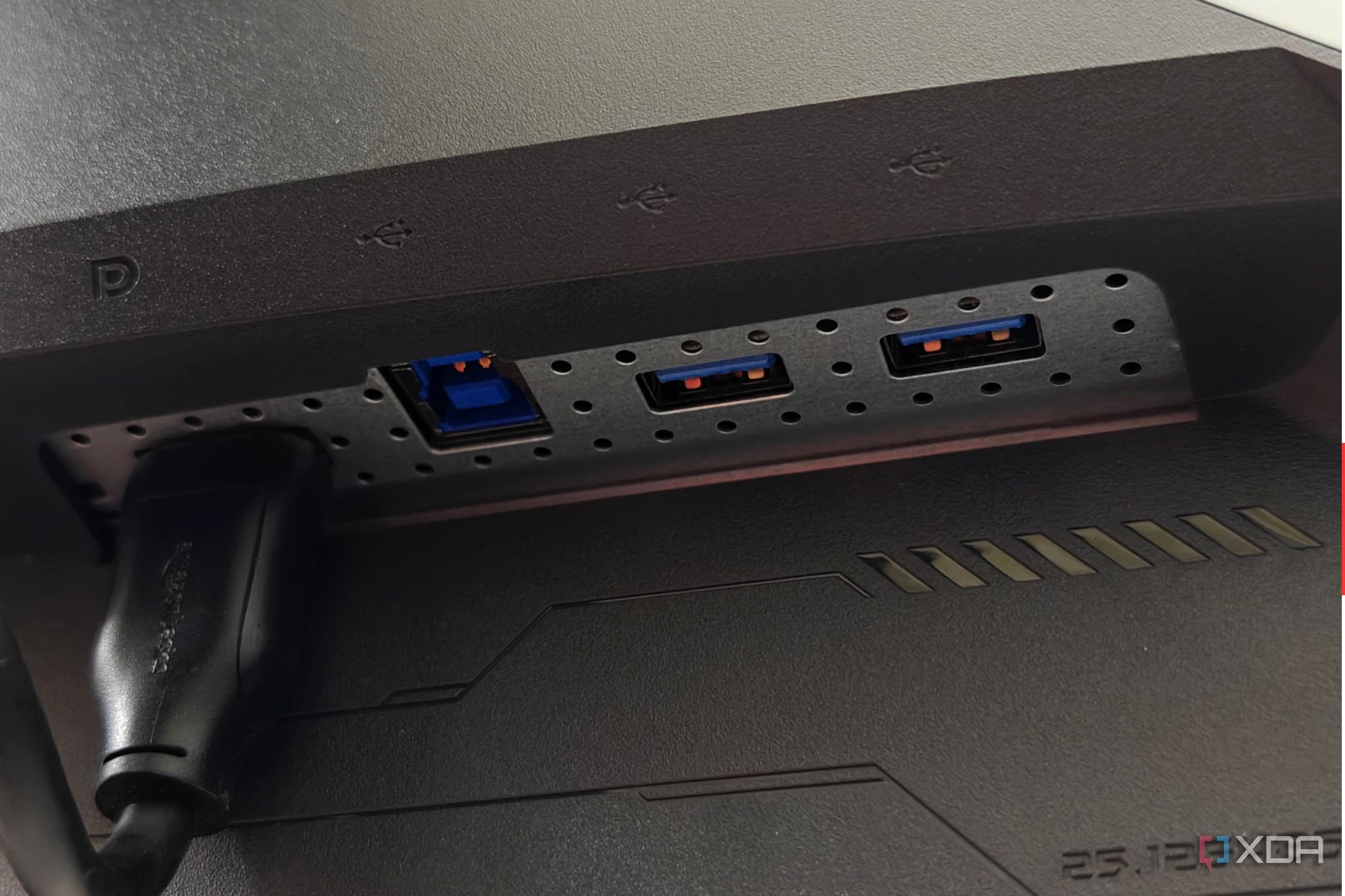 An image showing the right side ports of the Asus ROG PG27AQDM monitor.